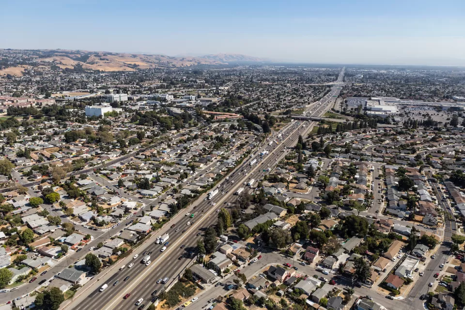 Aerial view of highway through neighborhood in Oakland, California.